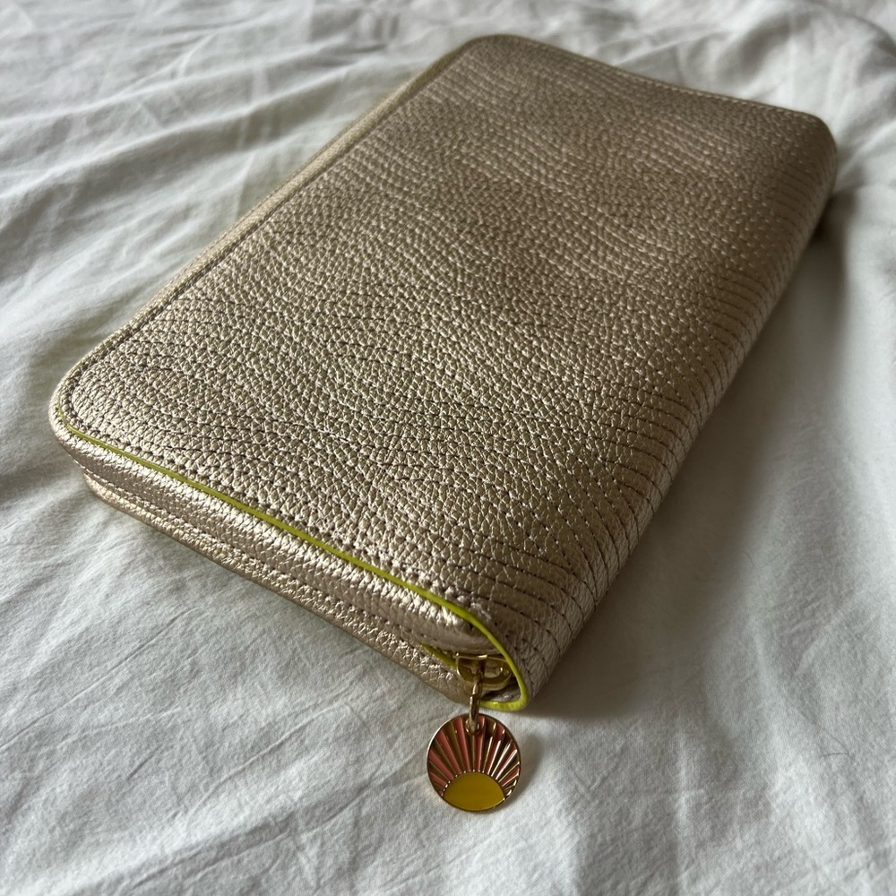 Anthropologie Champagne Gold Textured Large Wallet/ Notebook case with Sun Charm